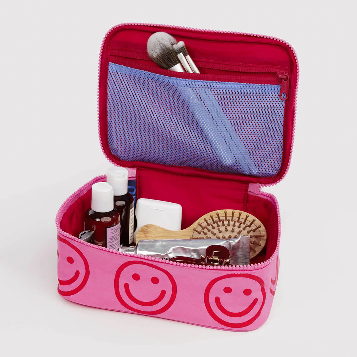 Small Cosmetic Case in Azalea Pink Happy by Baggu