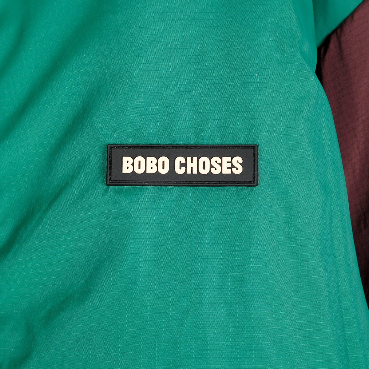 Reversible Nylon Sherpa Jacket in Dark Brown by Bobo Choses Womenswear