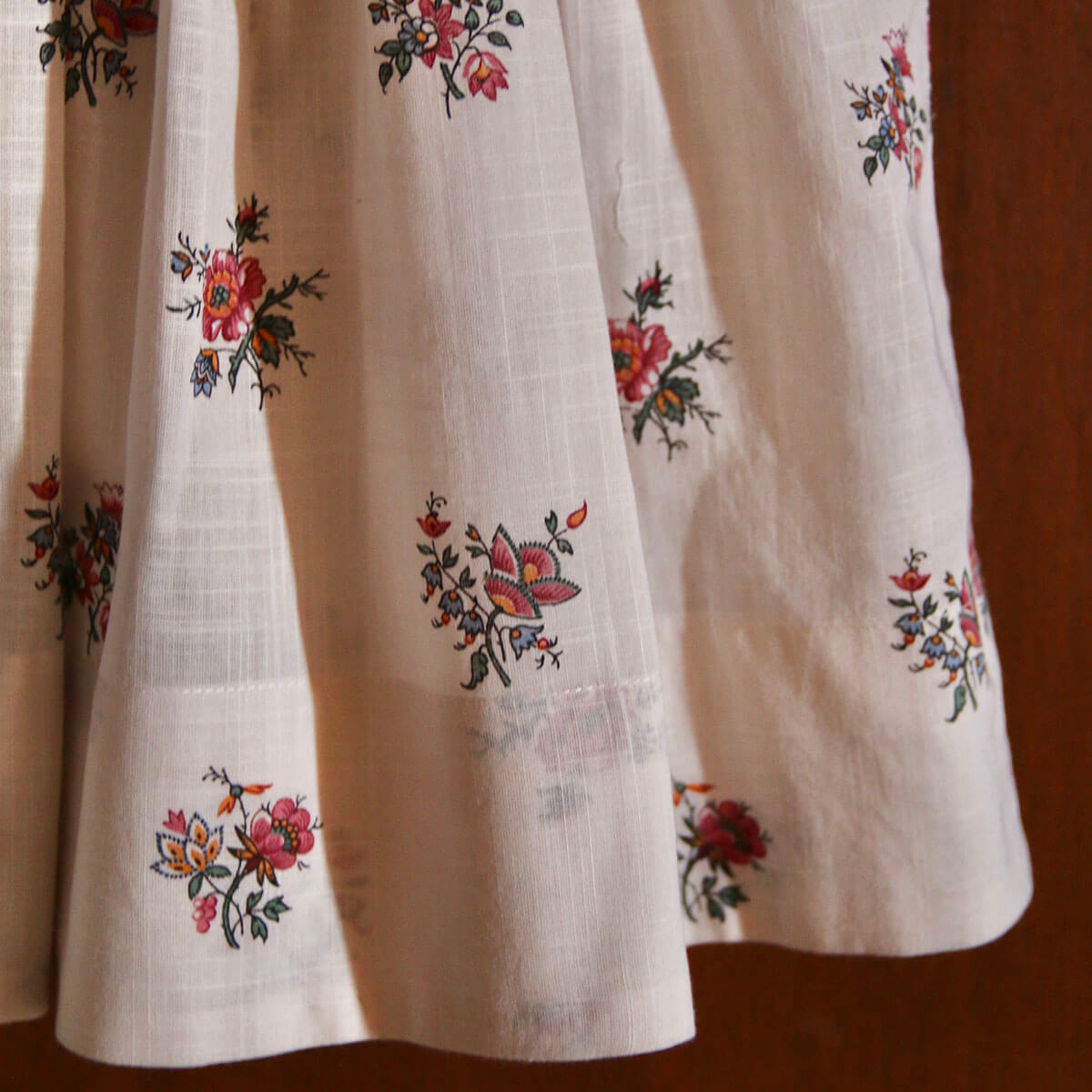 Handsmock Apron Dress in Garden Flowers Print by Bonjour