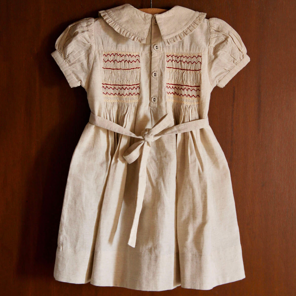 Handsmock Apron Dress in Natural by Bonjour