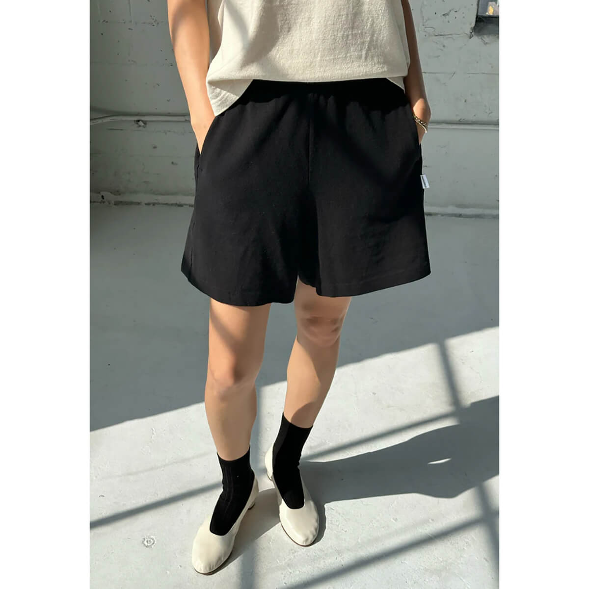 Flared Basketball Shorts in Black by Le Bon Shoppe