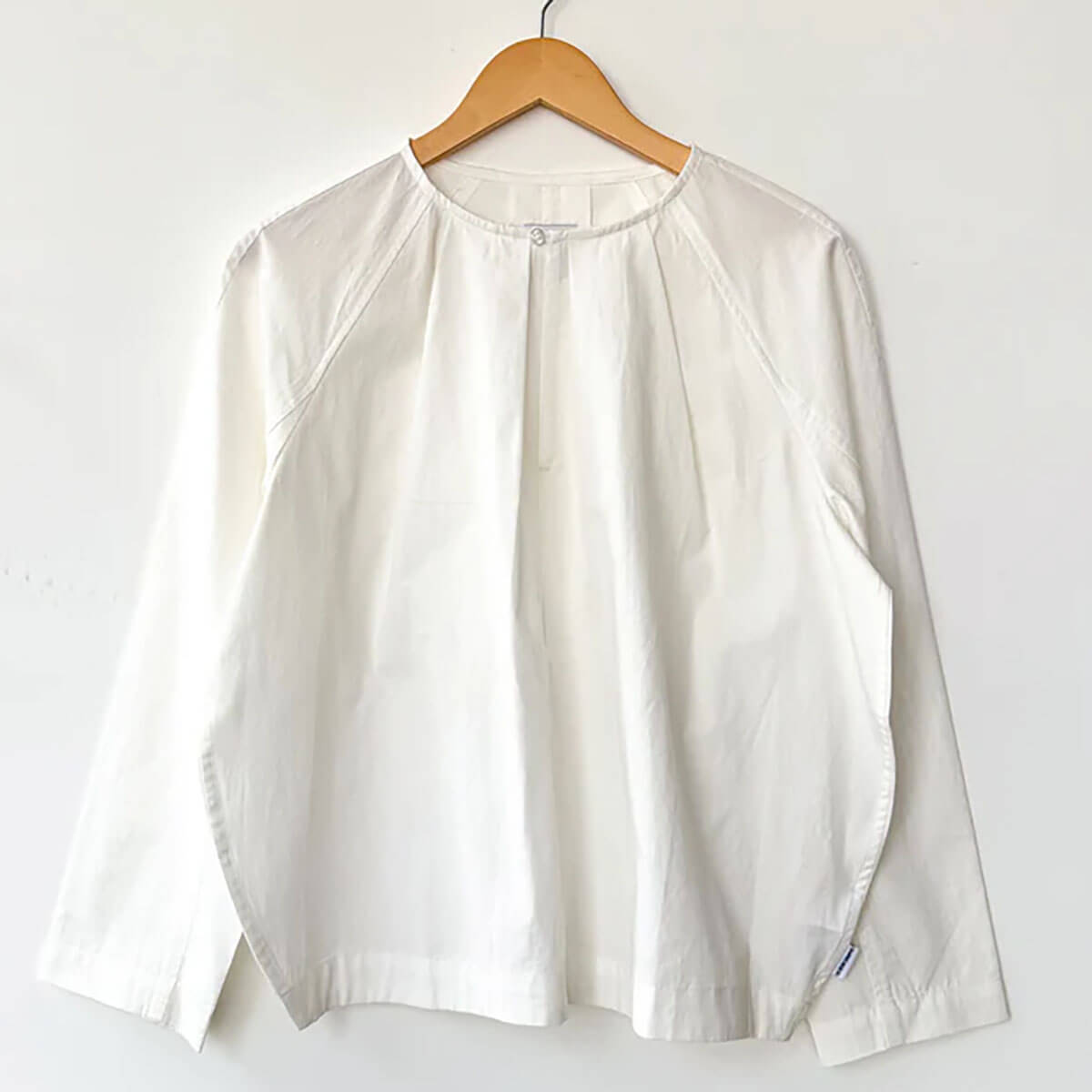 Julienne Long Sleeve Top in White by Le Bon Shoppe