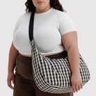 Large Nylon Crescent Bag in Black And Cream Gingham by Baggu