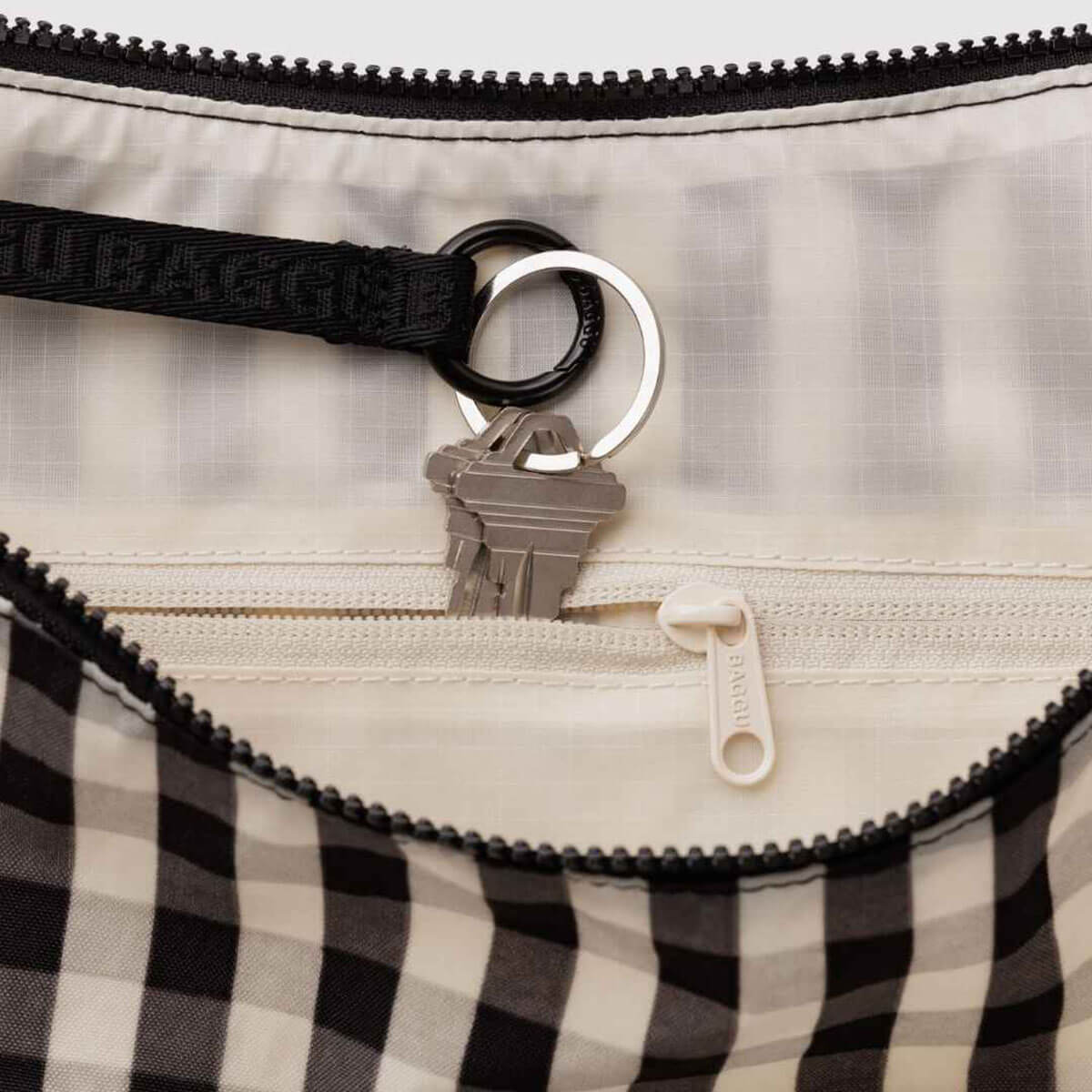 Large Nylon Crescent Bag in Black And Cream Gingham by Baggu