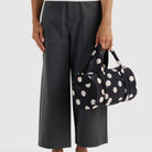 Nylon Duffle Bag in Black And Cream Polka Dot by Baggu