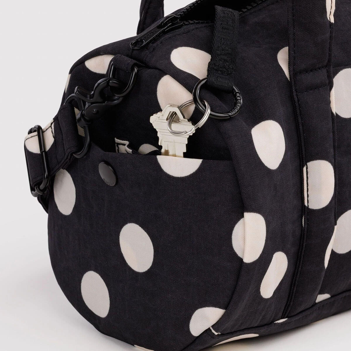 Nylon Duffle Bag in Black And Cream Polka Dot by Baggu