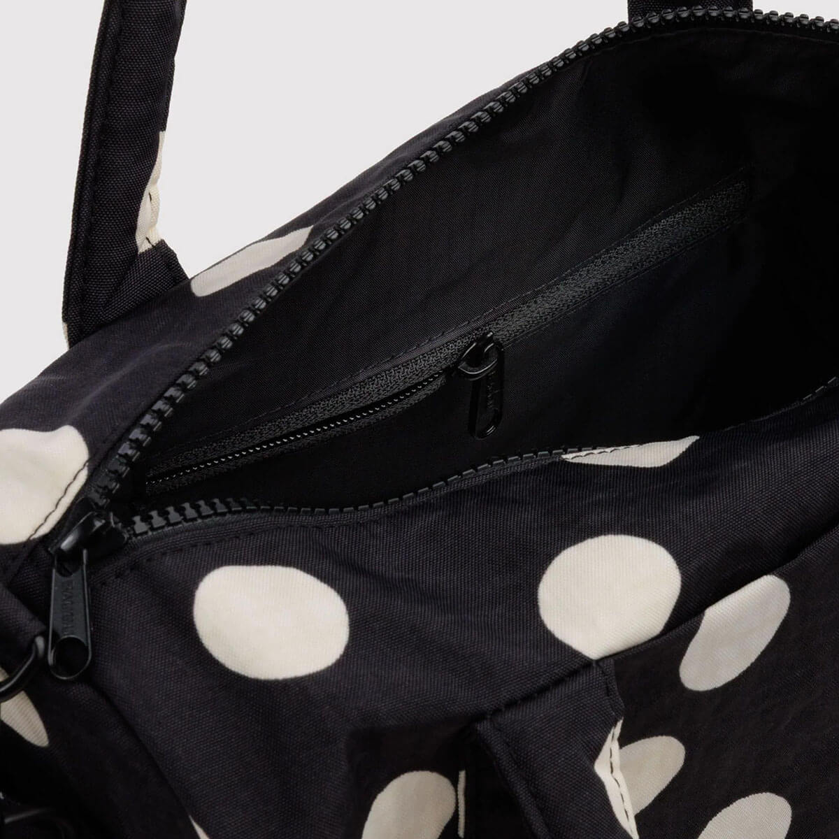 Nylon Duffle Bag in Black And Cream Polka Dot by Baggu