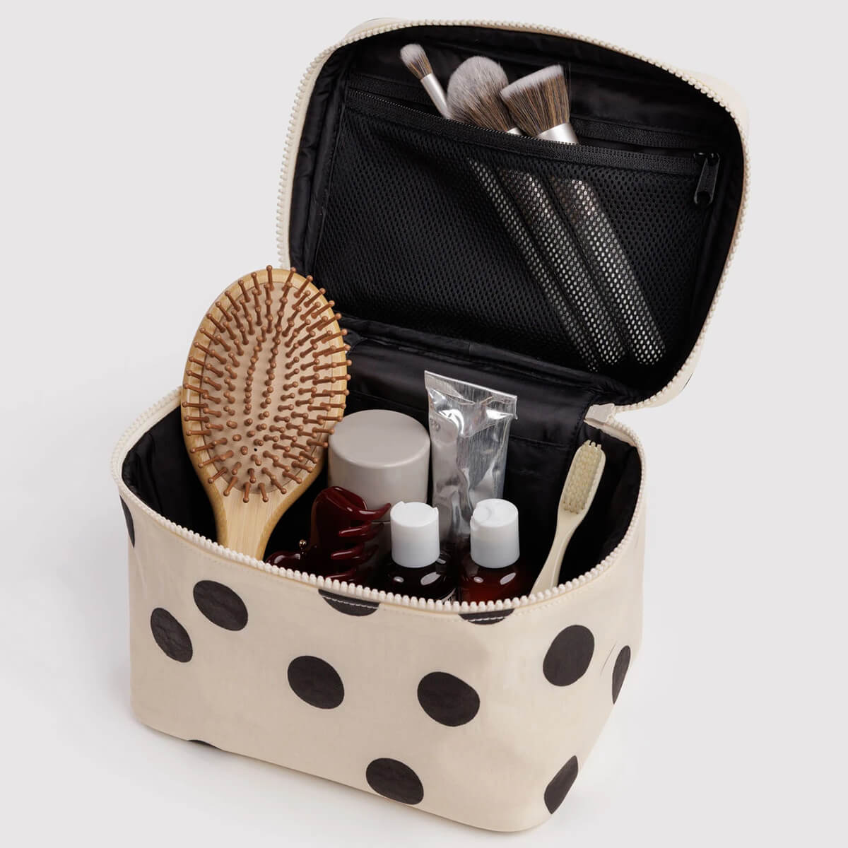 Large Cosmetic Case in Cream and Black Polka Dot by Baggu
