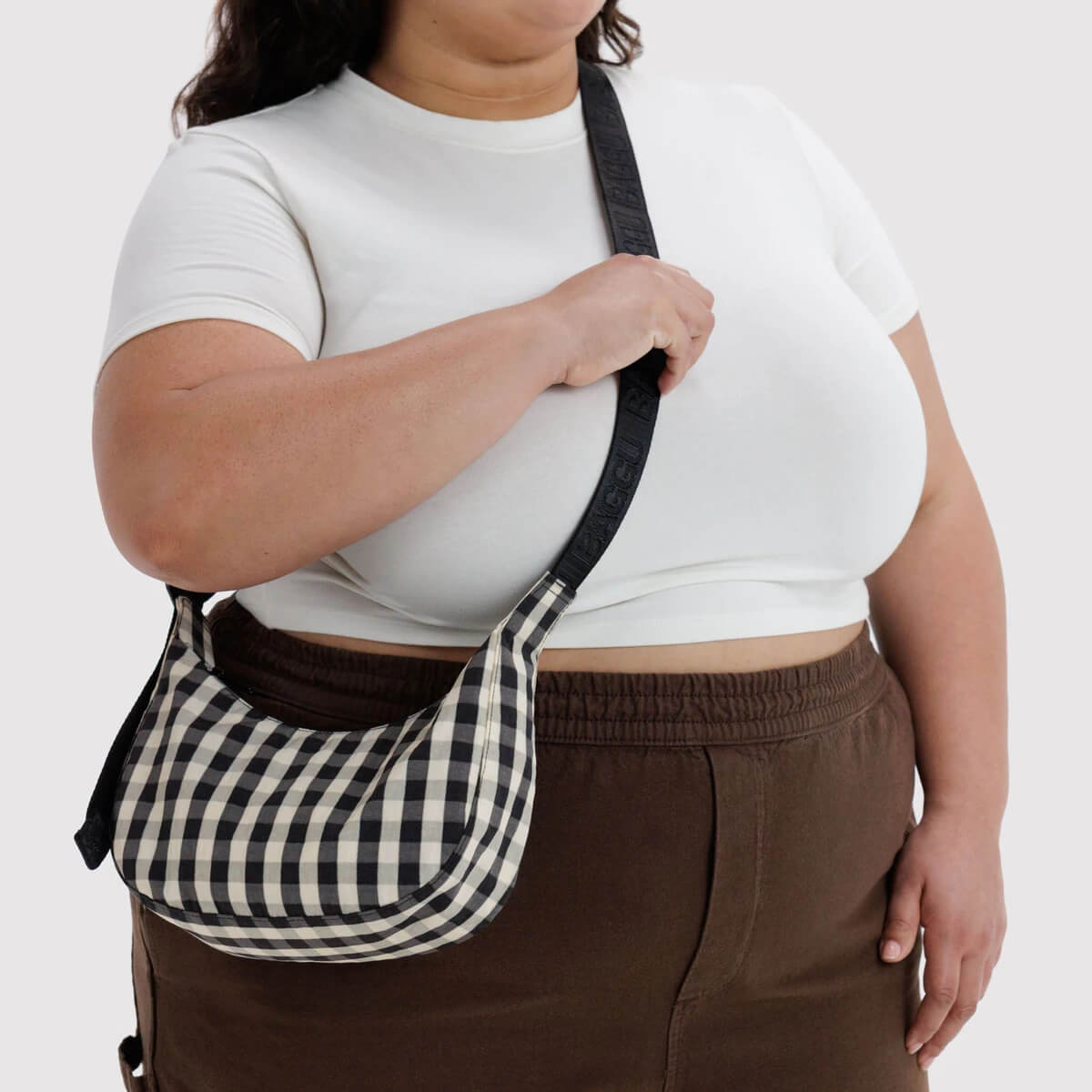 Small Nylon Crescent Bag in Black And Cream Gingham by Baggu