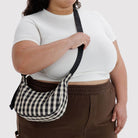 Small Nylon Crescent Bag in Black And Cream Gingham by Baggu