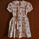 Handsmock Apron Dress in Garden Flowers Print by Bonjour