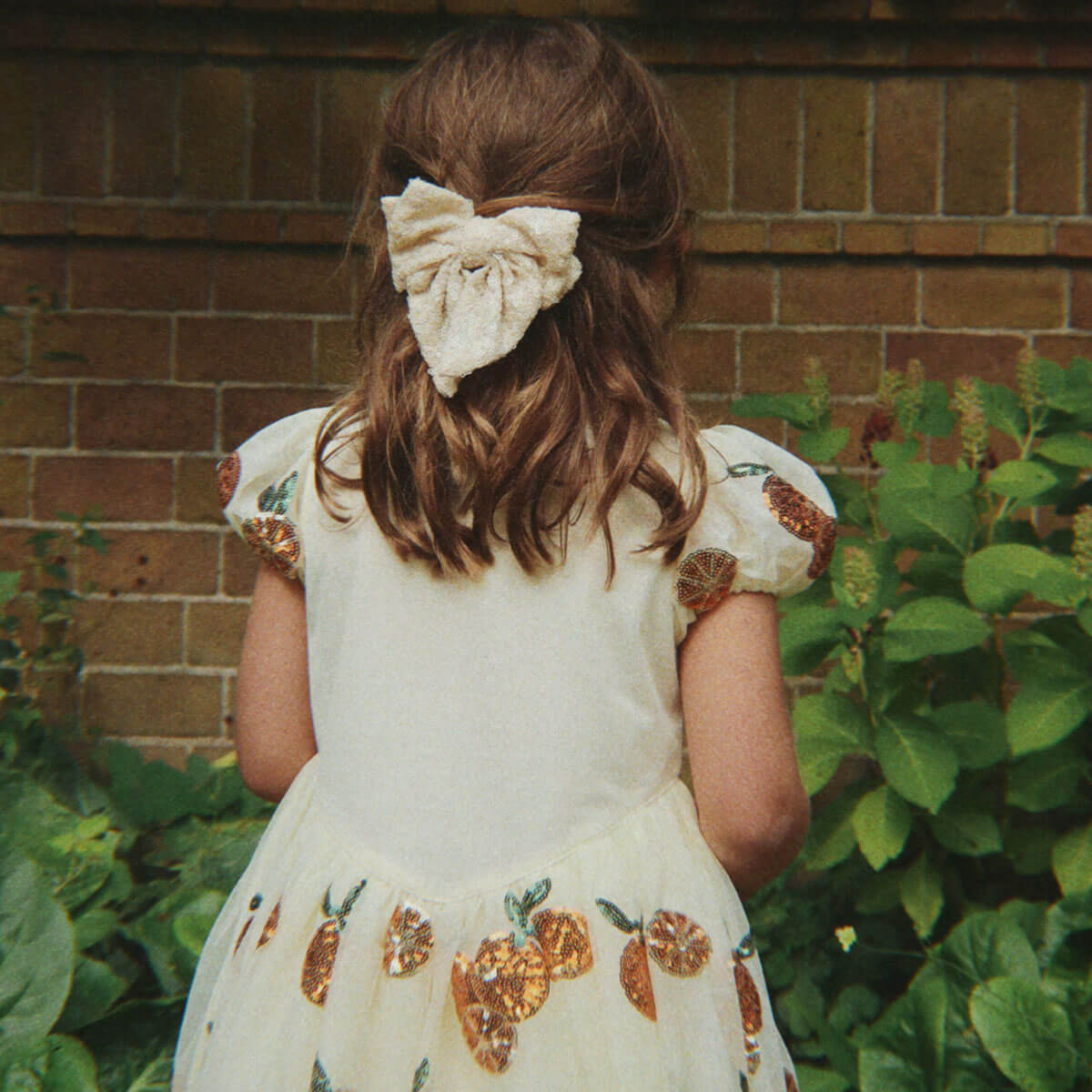 Aries Sequin Bow Hair Clip in White Smoke by Konges Sløjd