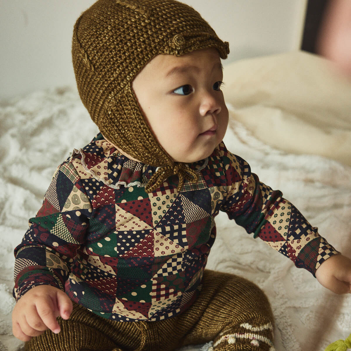 Baby Pattie Onesie in Madder Root Patchwork by Misha & Puff