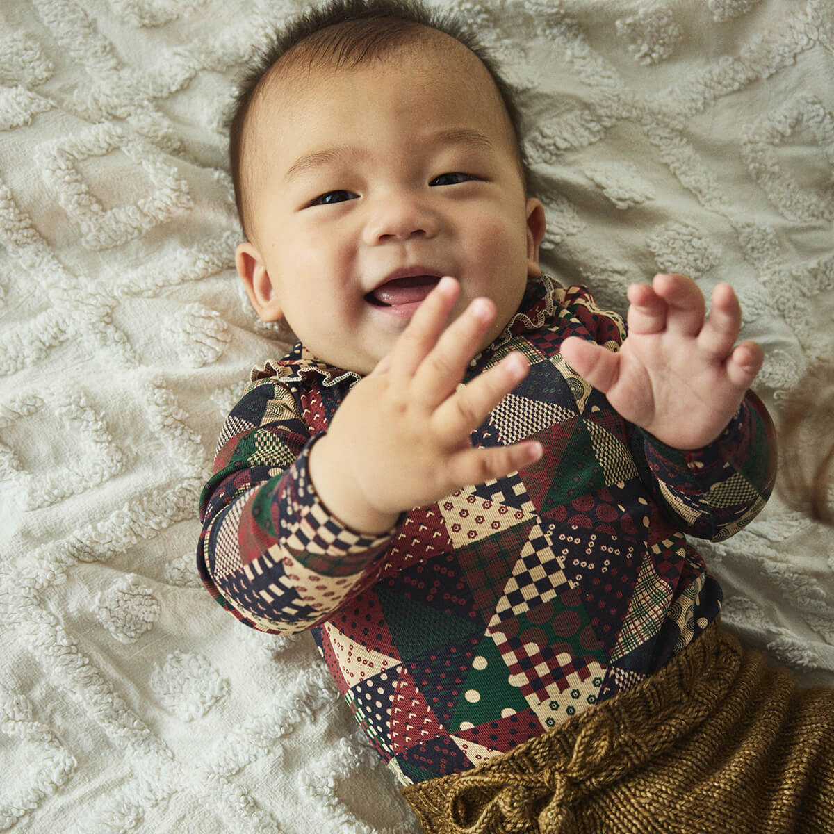 Baby Pattie Onesie in Madder Root Patchwork by Misha & Puff