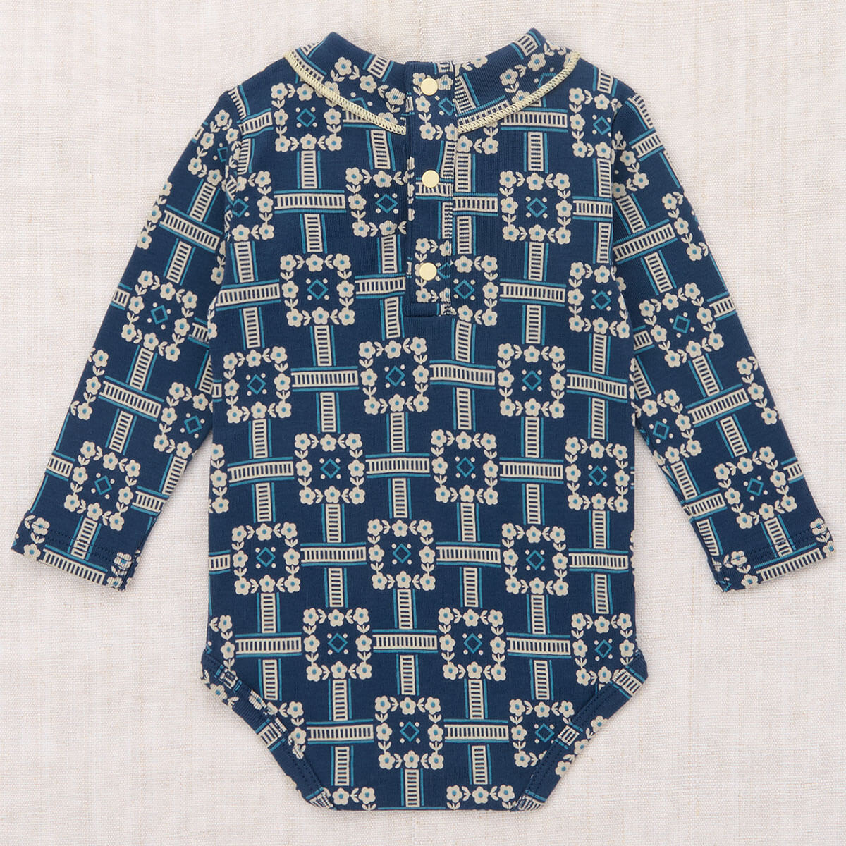 Baby Scout Onesie in Moonlight Railroad Floral by Misha & Puff
