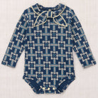 Baby Scout Onesie in Moonlight Railroad Floral by Misha & Puff