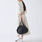 Compact Bag Size M in Jet Black by Shupatto