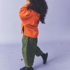 Manu Overdye Denim Trousers in Acid Green by Studio Koter