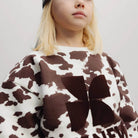 TNS Logo Sweatshirt in Cow Print by The New Society