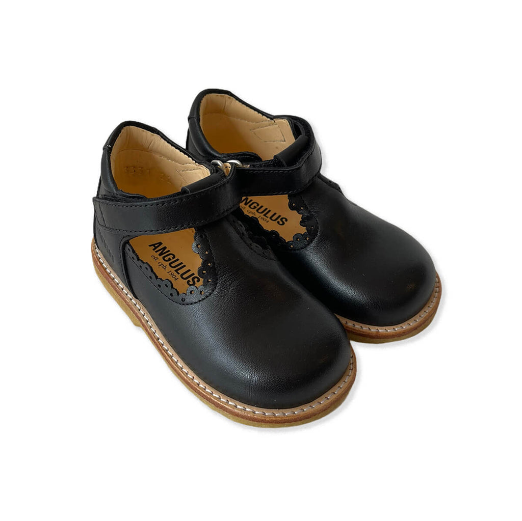 Scallop T Bar Starter Mary Janes in Black by Angulus